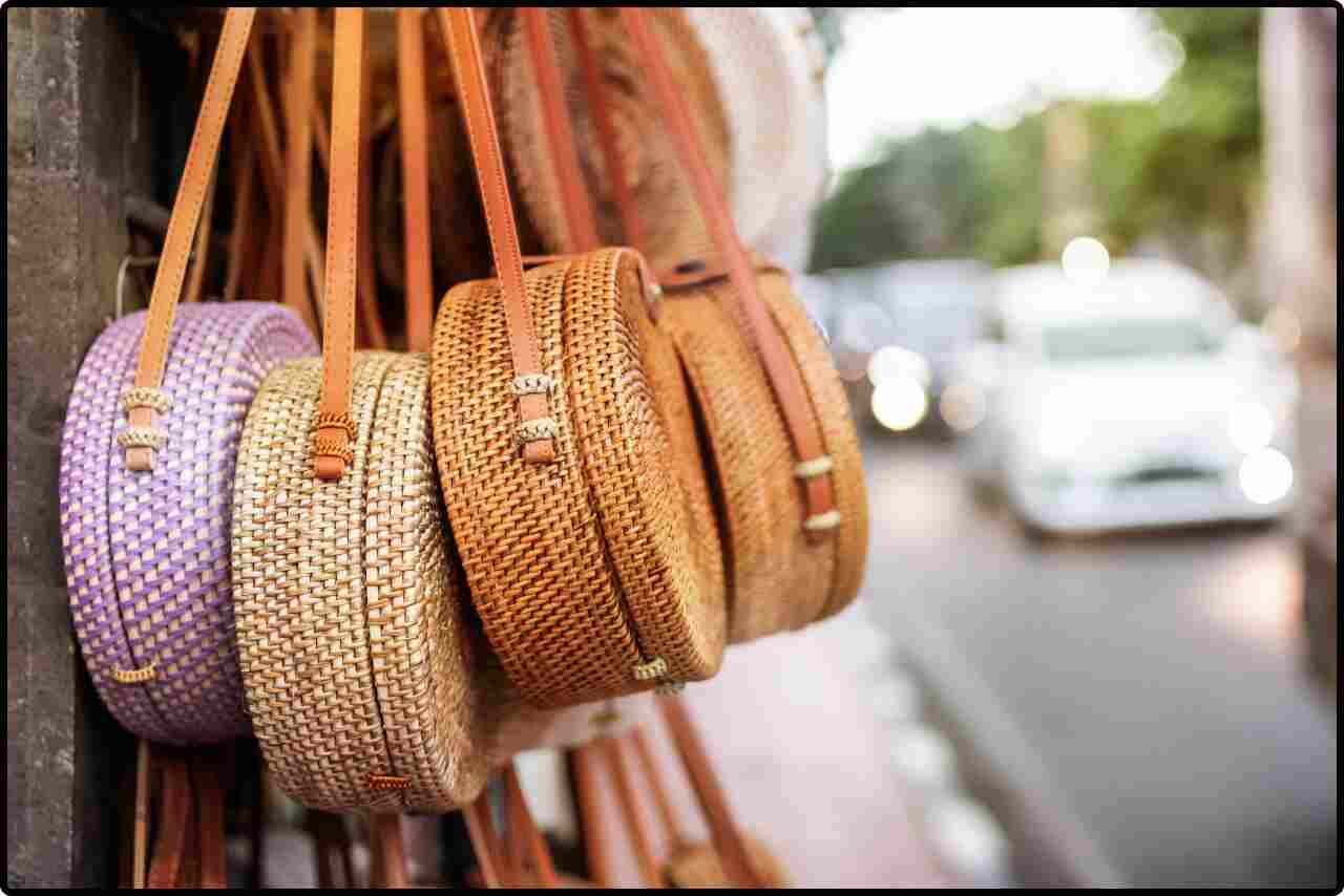 Different colored crossbody bags arranged in side by side, showcasing variety.